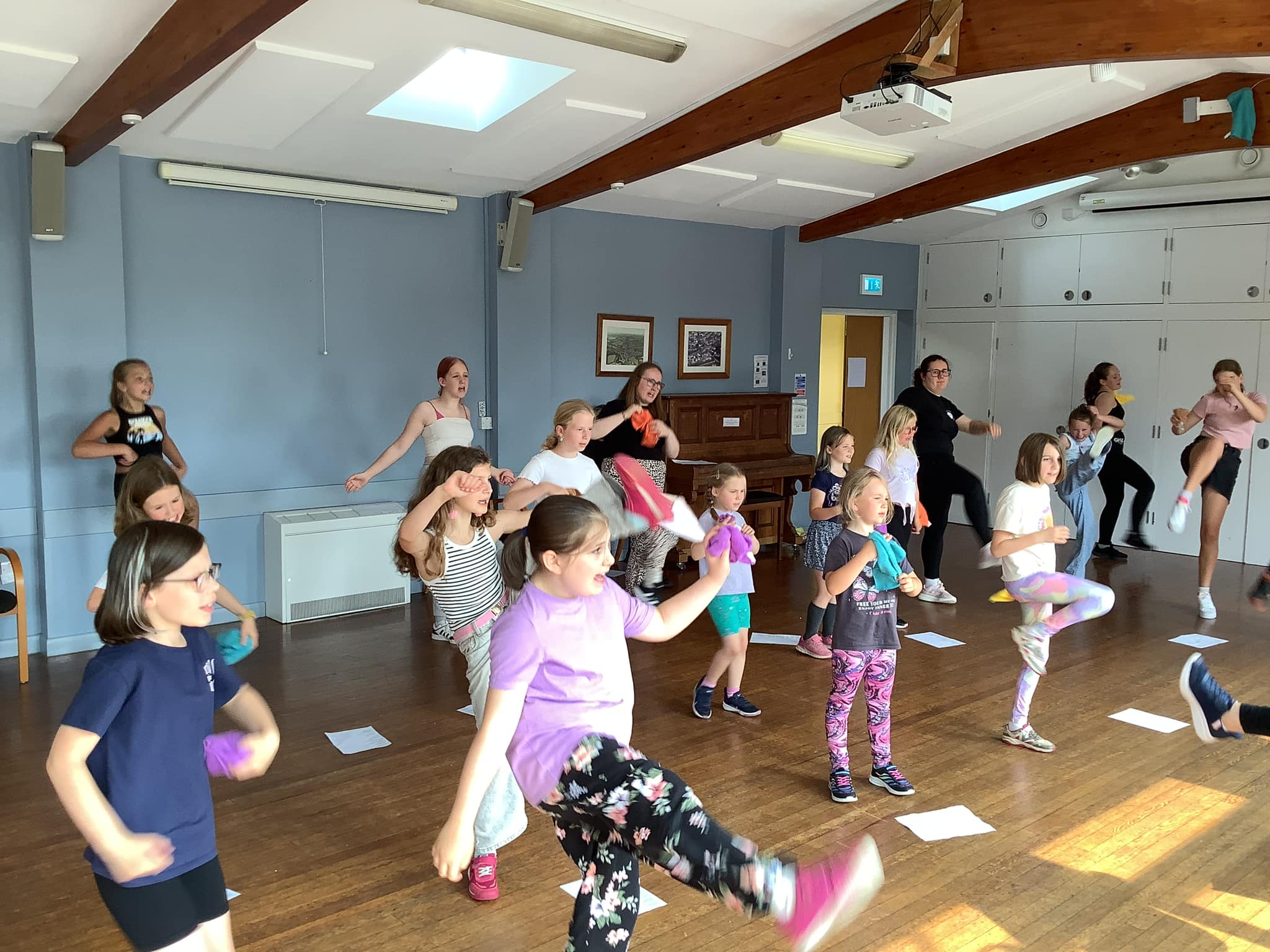 This image shows children dancing to an Annie song.