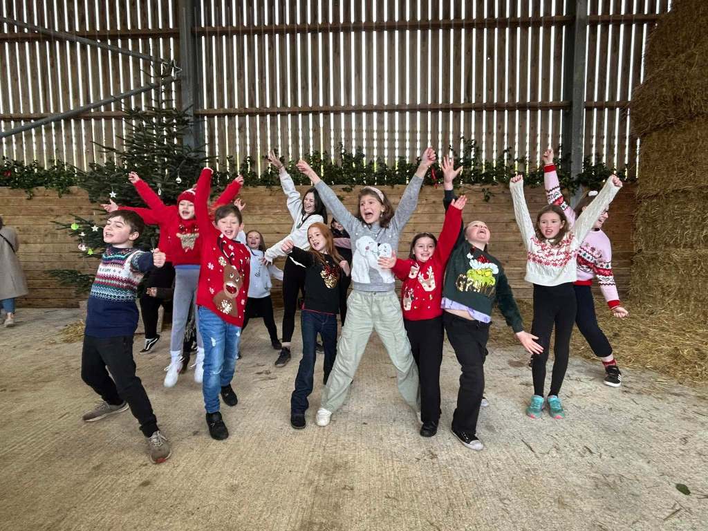 This image shows some of the children at Stagezone performing at a market in Truro