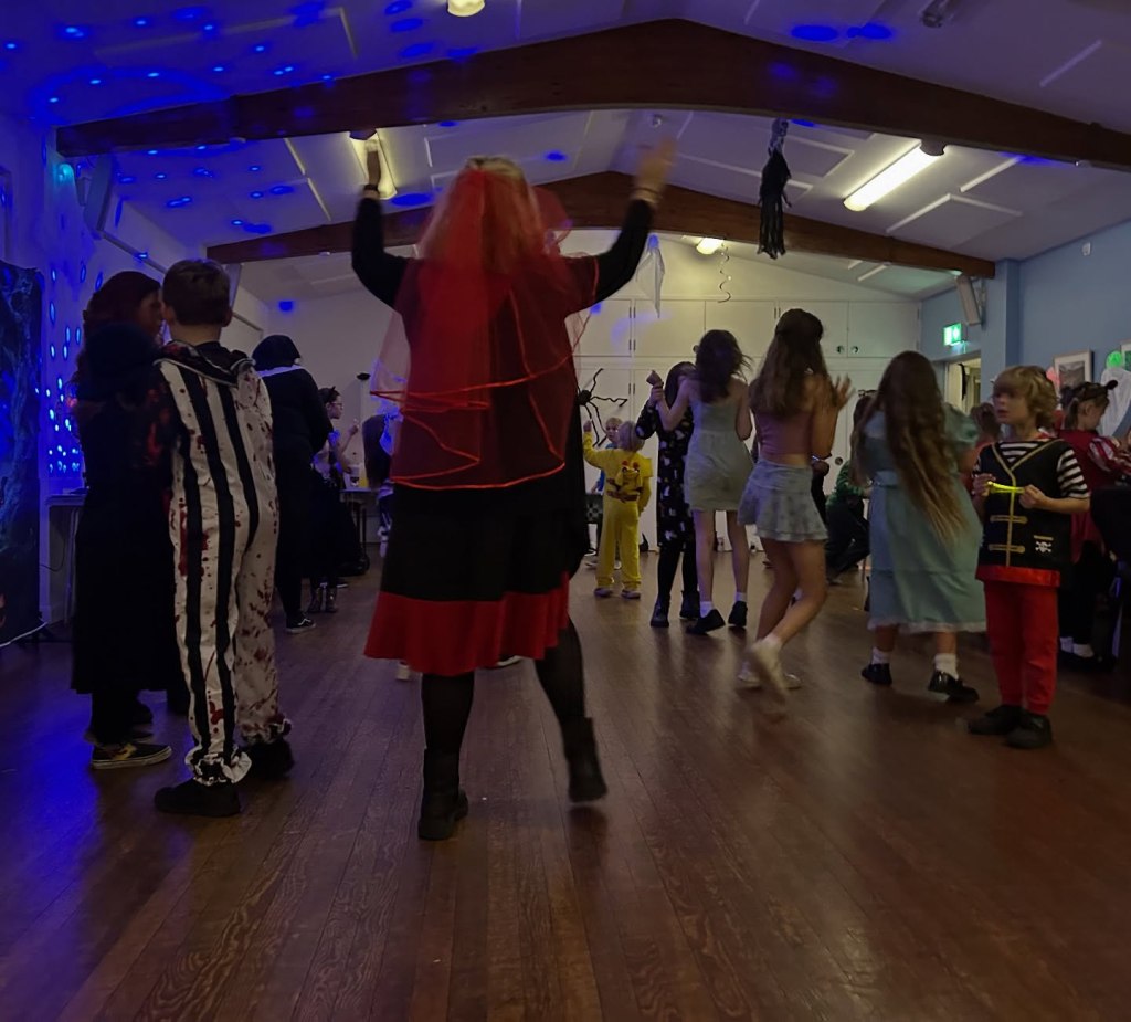 Kids dancing at Stagezone Youth Theatre's Halloween Party event.
