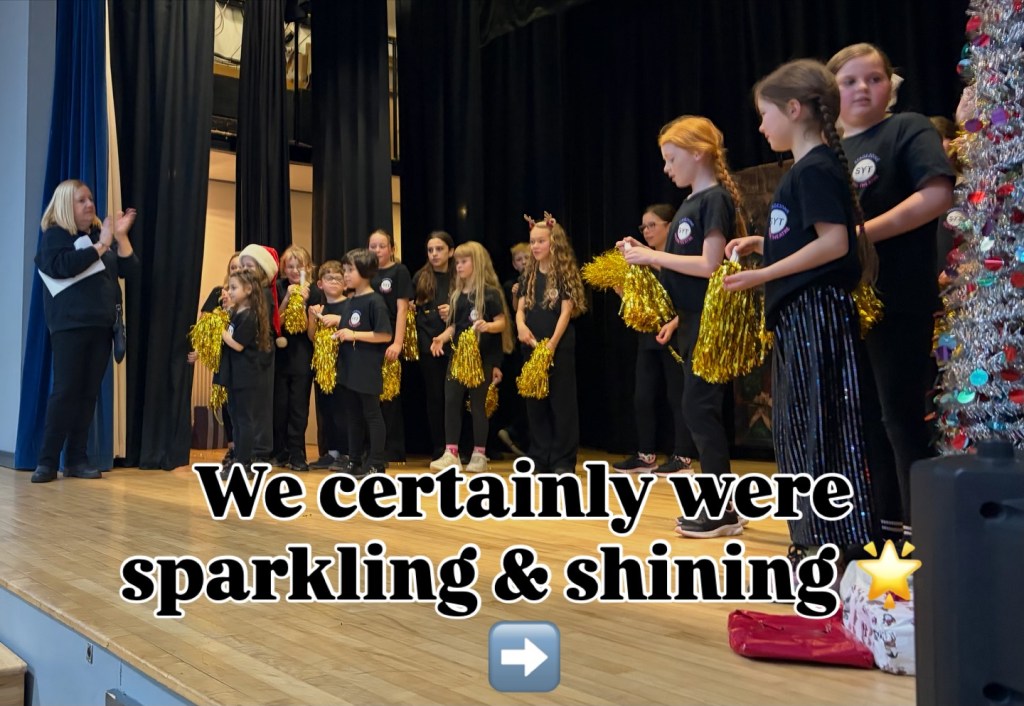 Children on stage with pom poms at Stagezone Youth Theatre's Sparkle & Shine show